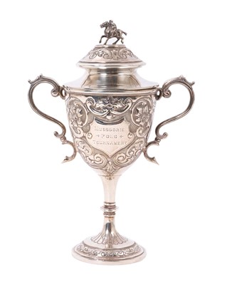 Lot 986 - Edwardian silver two handled trophy with embossed foliate scroll decoration and player and polo pony knop