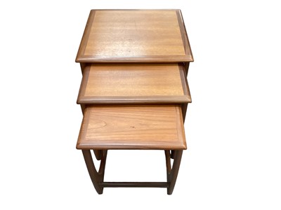 Lot 1203 - G-Plan teak nest of three occasional tables, together with a leather pouffe (2)