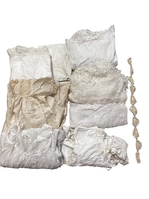 Lot 2104 - Quantity of Edwardian and later white cotton and lace, crochet and broderie anglaise items including women's petticoats, nighties, camisoles. Plus babies Christening clothing, dresses and petti...