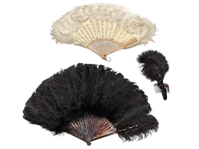 Lot 2106 - Cream Ostrich feather and faux seed pearl fan, black Ostrich feather and similar small hand fan Valencia Berlin.