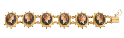 Lot 429 - Victorian bracelet with six porcelain and mother of pearl panels in gilt metal mounts