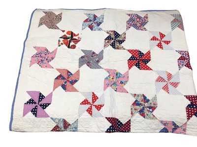 Lot 2114 - American square and triangle design patchwork quilt mainly handstitched with some machine stitching. Dated 1950. 170 cms x 220 cms approximately. Plus similar quilt in windmill/pinmill design al...