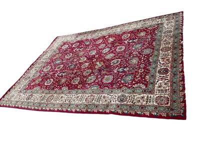 Lot 1413 - Heriz style carpet, with allover palmette ornament of claret ground