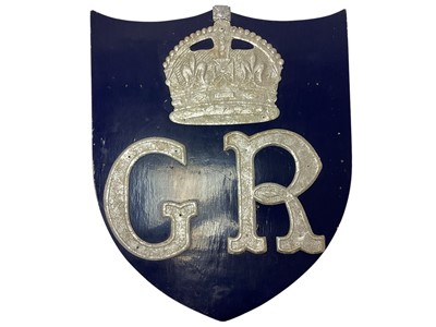 Lot 83 - 1930s King George V Shield probably for the Silver Jubilee celebrations in 1936 with silvered crowned GR cipher on blue ground to the front and flag sockets to the rear 58cm high x 49cm wide