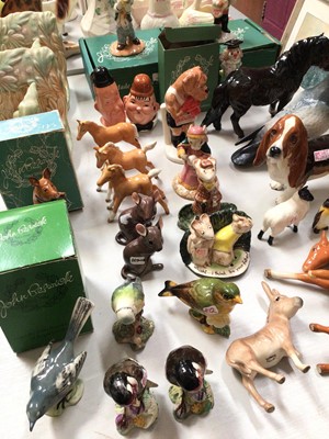 Lot 303 - Collection of Beswick animal and bird ornaments, Laurel and Hardy salt and pepper set and pair of rabbit book ends