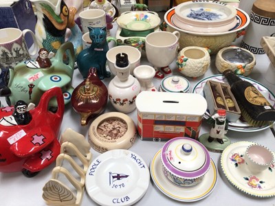 Lot 331 - Group of Carlton Ware including two novelty aircraft teapots, money box in the form of a bus, various dishes, cups etc, together with Clarice Cliff Celtic Harvest, Poole pottery cat, Royal Winto...