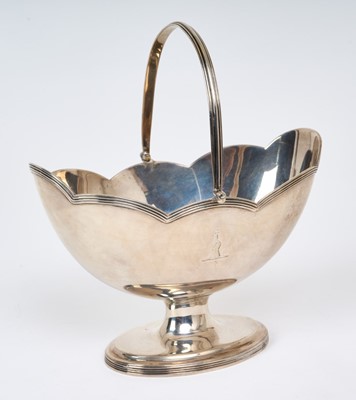 Lot 277 - George III silver swing handled sugar basket