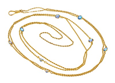 Lot 406 - Antique gold rope twist chain with eight mixed cut blue stones in spectacle setting, clasp stamped 10K.