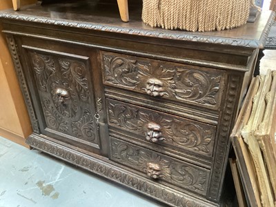 Lot 1256 - Victorian heavily carved oak sideboard with ledge back, cupboard and drawers below, 137cm wide, 57.5cm deep, 120cm high