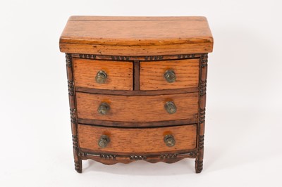 Lot 787 - Antique miniature oak chest of drawers, of bowed form with