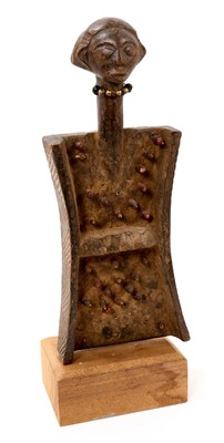 Lot 831 - African tribal Lukasa carved wooden memory board, with mask terminal, 27cm, mounted on wooden plinth