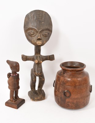 Lot 834 - African tribal figure, 46cm high, together with another smaller and a carved wooden vessel