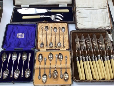 Lot 1060 - Three sets of six silver teaspoons and plated flatware in cases