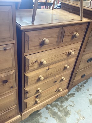 Lot 1297 - Pine chest of two short and four long drawers, 74cm wide, 45cm deep, 111cm high, together with another chest of five drawers, 57cm wide, 45cm deep, 126.5cm high and a pine desk (3)