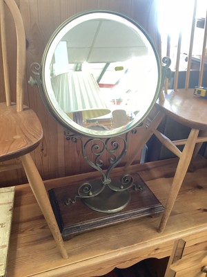 Lot 1298 - Bevelled mirror in ornate brass frame on oak plinth base, 47cm wide, 74cm high