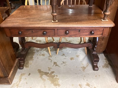 Lot 1309 - 19th century mahogany two drawer table on shaped end standards joined by stretcher, 113cm wide, 72cm deep, 72cm high