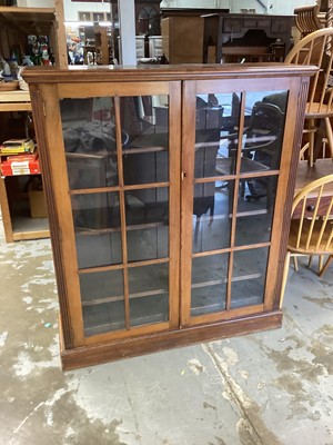 Lot 1310 - Late Victorian mahogany bookcase with two glazed doors, 122cm wide, 34.5cm deep, 137.5cm high