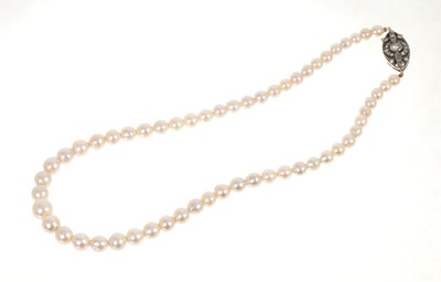 Lot 459 - Cultured pearl necklace with a string of graduated cultured pearls measuring approximately 7.7-4.9mm on an antique continental white gold and diamond clasp with rose cut diamonds, 36cm length.