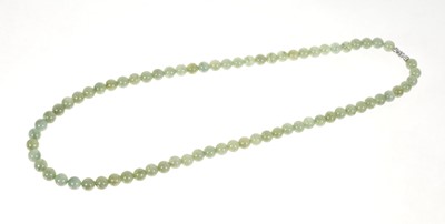 Lot 460 - Jadeite jade bead necklace with a string of spherical beads measuring approximately 7.3mm diameter on white metal clasp, accompanied by a Jade Report by the GIA dated January 9th 2023 stating no...