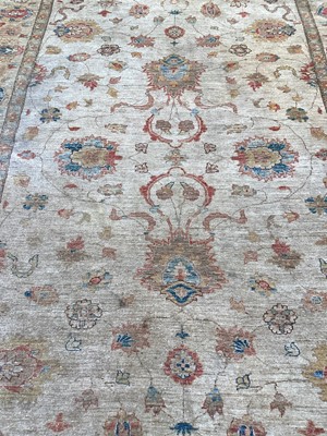 Lot 1331 - Large rug on beige ground, 293cm x 208cm