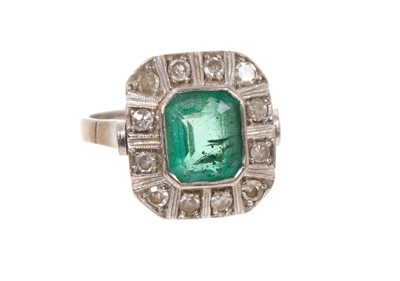 Lot 464 - Art Deco style emerald and diamond cluster ring with a rectangular step cut emerald measuring approximately 8.3 x 7 x 4.5mm, surrounded by a border of 12 single cut diamonds, ring size L.