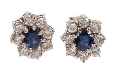 Lot 471 - Pair of sapphire and diamond cluster earrings