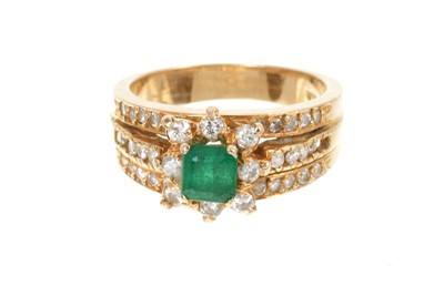 Lot 465 - Emerald and diamond ring with a central emerald and diamond cluster on a triple band with brilliant cut diamonds and tapered gold shank, ring size L½.