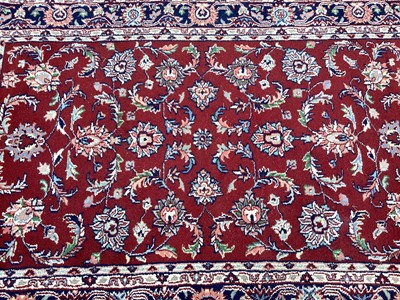 Lot 1508 - Eastern rug with floral decoration on red and blue ground, 176cm x 118cm