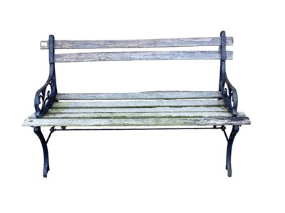 Lot 1343 - Iron and slatted wood garden bench, 122cm wide