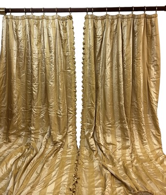 Lot 1429 - Two pairs of Pierre Frey Etad silk and acetate gold striped curtain with tasselled fringe and rope braid decoration with very large pelmet for bay window. Pair one- top width 290cm, full fabric...