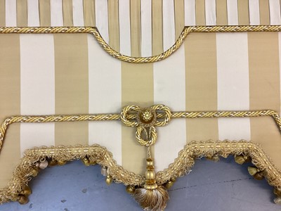 Lot 1429 - Two pairs of Pierre Frey Etad silk and acetate gold striped curtain with tasselled fringe and rope braid decoration with very large pelmet for bay window. Pair one- top width 290cm, full fabric...