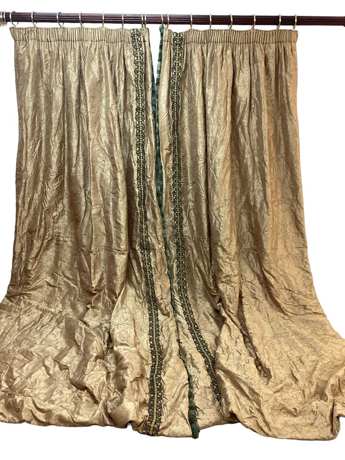 Lot 1431 - Three pairs of golden brown Pierre Frey curtains with decorative trimming down the side and matching swag and drape pelmets. Gathered top width 100cm, full fabric width 186cm, drop length 321cm....