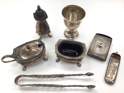 Lot 1045 - Silver three piece cruet set by Garrard & Co, silver egg cup, pair of silver sugar tongs and two other silver pieces