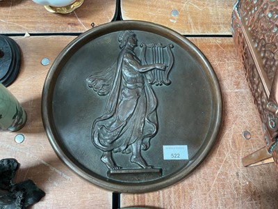 Lot 522 - Circular bronze wall plaque decorated in relief with a classical figure playing a lyre.