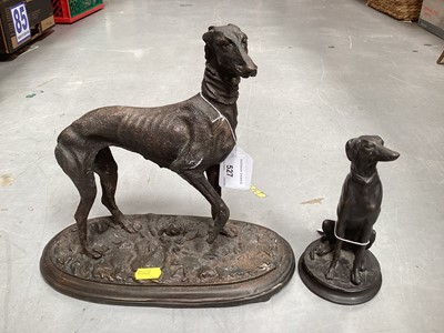 Lot 527 - Bronzed metal sculpture of a standing greyhound, together with another smaller of a seated greyhound (2).