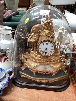 Lot 530 - Late 19th century French gilt metal clock under a glass dome.