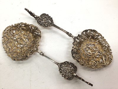 Lot 1062 - Pair of Late Victorian Dutch style silver gilt marriage spoons with pierced decoration (Birmingham 1892)