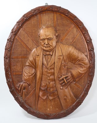 Lot 73 - Large WWII carved wooden plaque depicting Sir Winston Churchill, formerly on display on The Winston Churchill, Trinity House vessel, together with a photograph..