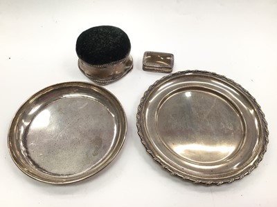 Lot 1076 - Two silver dishes, silver mounted pin cushion and a silver pill box