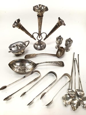 Lot 1096 - Group of silver including a three branch epergne, three pairs of sugar tongs, cruets, spoons and five Mexican leaf shaped spoons