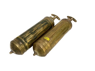 Lot 52 - Two vintage brass war pyreens, marked with the war department broad arrow (2).