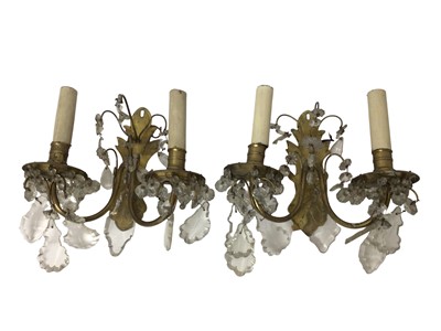 Lot 623 - Pair of brass and glass drop wall lights