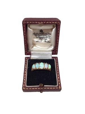 Lot 1104 - 9ct gold opal five stone ring in carved claw setting, size R½