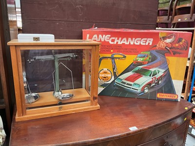 Lot 582 - Gallenkamp chemical balance scales in glazed case, together with weights and a Matchbox Lanechanger set