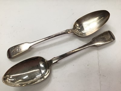 Lot 1118 - Two Georgian silver serving spoons with engraved crests