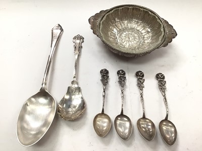 Lot 1119 - Four German silver rose teaspoons, two plated spoons and a continental white metal dish with glass liner