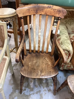 Lot 1424 - Two 19th century elm and beech kitchen elbow chairs