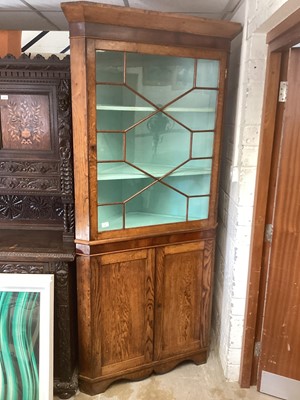 Lot 1425 - Georgian oak and mahogany two height corner cupboard, 102cm wide, 214cm high and