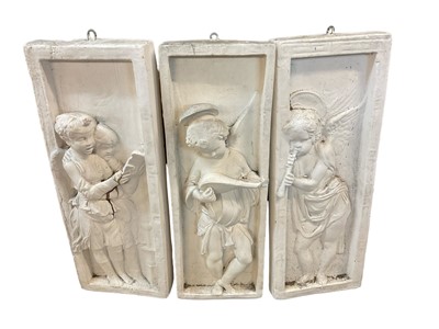 Lot 387 - Set of three moulded plaster panels, in the classical style