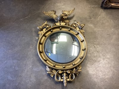 Lot 1429 - Antique style convex wall mirror in gilt frame with eagle surmount